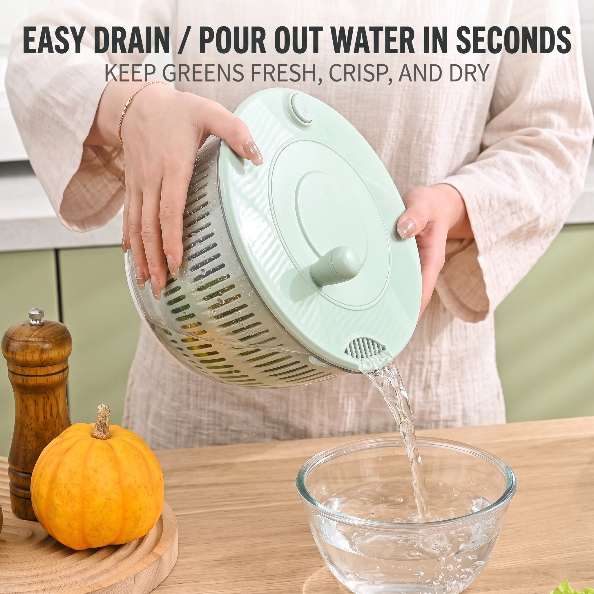Pouring water out of the PrepLoop bowl through the built-in drain spout to keep greens crisp and dry