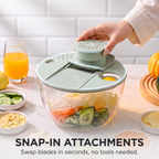 Turning the PrepLoop lid knob to spin-wash and dry salad greens with the 360 degree mechanism