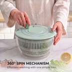 Hand fitting a snap-in grater attachment onto the PrepLoop mandoline lid over a bowl of prepped vegetables