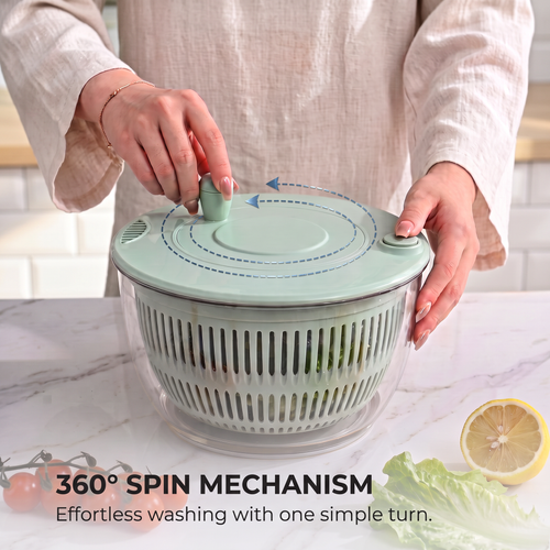 Hand fitting a snap-in grater attachment onto the PrepLoop mandoline lid over a bowl of prepped vegetables